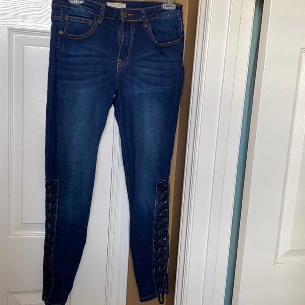 Stretch jeans with laces up legs.
